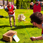 Participants working together on an outdoor Krypton Factor team challenge