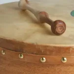 Traditional Irish bodhrán drum and wooden tippers for a group workshop