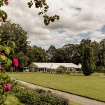 Ballyscullion Park marquee and lawn framed by roses in the walled garden