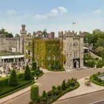 Exterior overview of Cabra Castle and its landscaped grounds