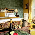 Guest bedroom with ornate bed at Clone House