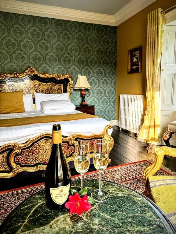 Guest bedroom with ornate bed at Clone House