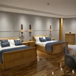Dexter Suite bedroom with two king-size beds at Glenpark Estate