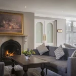 Reception lounge with fireplace at Hotel Woodstock in Ennis