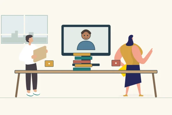 Office colleagues and a remote teammate contribute to a shared card-and-block activity.
