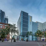 Exterior overview of Maldron Hotel Belfast City and the surrounding square